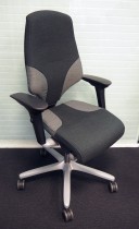 Giroflex 64 kontorstol i grønt stoff, grått fotkryss, høy rygg og armlene, pent brukt